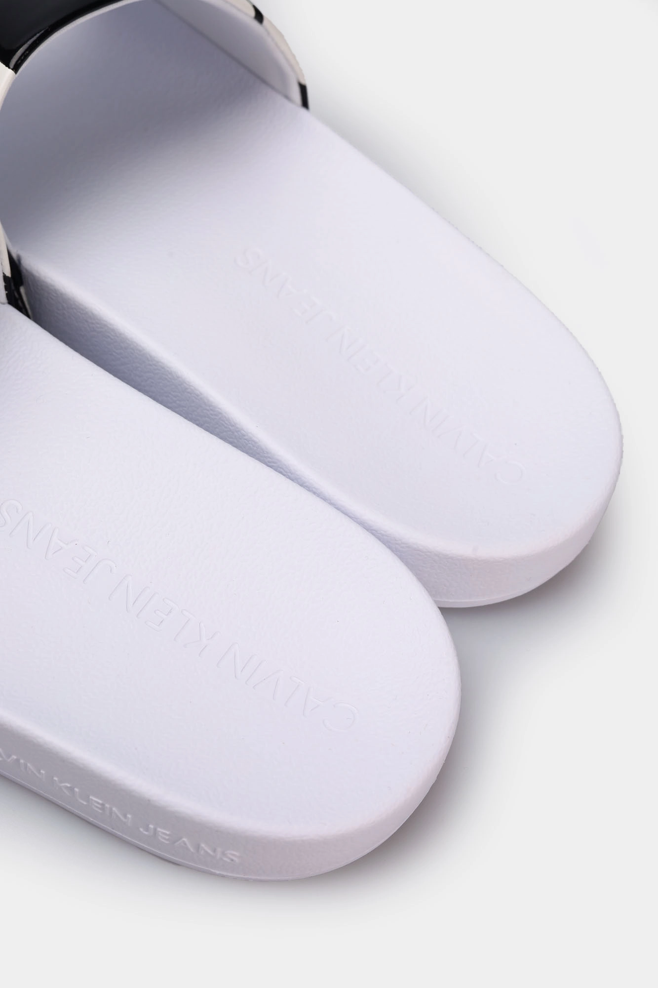 Calvin klein flip flops white clearance
